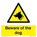 beware-of-the-dog-with-dog-warning-symbol~